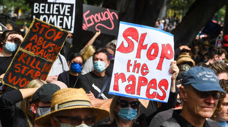 FILE PHOTO. People attend a protest against sexual violence and gender inequality in Melbourne on March 15, 2021.