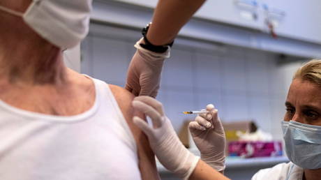 A man receives an injection of the Sputnik V vaccine at the Hungarian Army Medical Center in Budapest, Hungary on February 12, 2021.