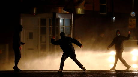 Rioters react as the police uses a water cannon on the Springfield Road as protests continue in Belfast, Northern Ireland April 8, 2021