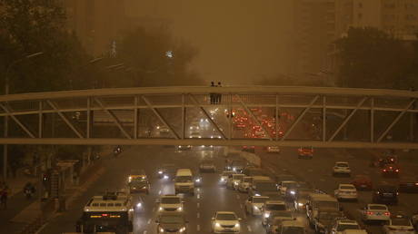 Beijing engulfed in yellow dust as authorities issue blue alert for sandstorms in central China