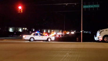 Police are seen at a street following a shooting incident at a FedEx facility in Indianapolis, Indiana, US April 16, 2021, in this still image taken from a video.