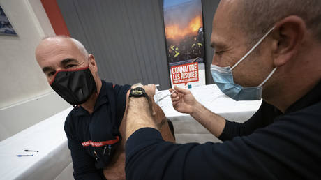 A firefighter receives a Pfizer BioNTech Covid-19 vaccine on January 8, 2021 in Avignon, France.