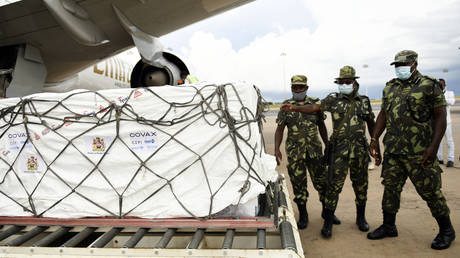 Malawian police guard AstraZeneca COVID-19 vaccines after the shipment arrived at the Kamuzu International Airport in Lilongwe, Malawi, Friday March 5, 2021.
