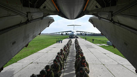 Servicemen of the Ivanovsky paratrooper unit board an Ilyushin Il-76MD military transport aircraft at the Taganrog-Tsentralny airfield as part of a control check following the winter training period, in Rostov region, Russia.