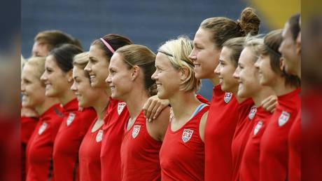 Soccer player Lori Lindsey is shown (center, with blond hair) with teammates in 2011 as Team USA prepared to face Japan in the World Cup final in Frankfurt.