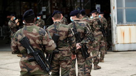 FILE PHOTO: French soldiers patrol the streets of Bretigny-sur-Orge, near Paris, France, November 2020. © Benoit Tessier / Reuters