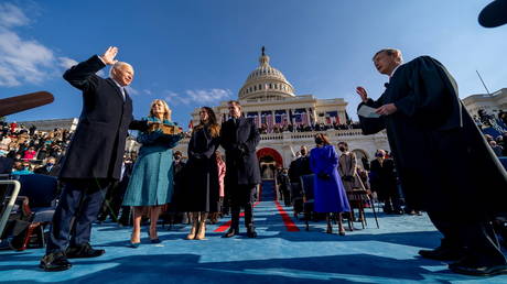 FILE PHOTO: Joe Biden is sworn in as the 46th president of the United States by Chief Justice John Roberts as Jill Biden holds the Bible during the 59th Presidential Inauguration at the US Capitol, in Washington, US, January 20, 2021