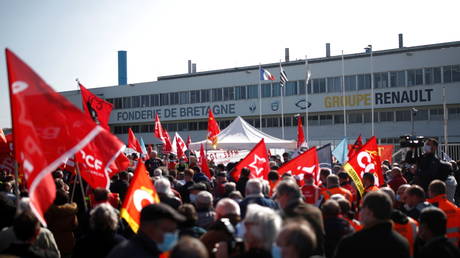 FILE PHOTO: Renault workers gather in front of the Fonderie de Bretagne, a subsidiary of Groupe Renault, in Caudan, France, March 23, 2021.