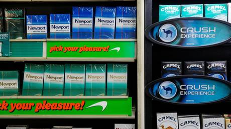 FILE PHOTO: Newport and Camel cigarettes are stacked on a shelf inside a tobacco store in New York July 11, 2014.