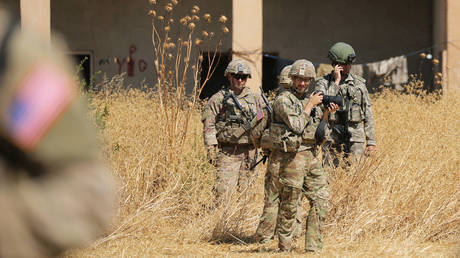 FILE PHOTO: Turkish and American soldiers stand near a former YPG military point during a joint U.S.-Turkey patrol, near Tel Abyad, Syria September 8, 2019.