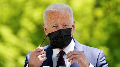 US President Joe Biden removes his face mask as he delivers remarks on the administration's coronavirus disease (COVID-19) response outside the White House in Washington, U.S., April 27, 2021.