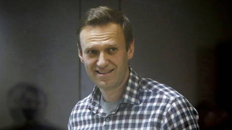 FILE PHOTO: Russian opposition politician Alexey Navalny attends a court hearing in Moscow, Russia February 20, 2021.