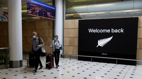 FILE PHOTO: Passengers arrive from New Zealand after the Trans-Tasman travel bubble opened overnight, following an extended border closure due to the coronavirus disease (COVID-19) outbreak, at Sydney Airport in Sydney, Australia, October 16, 2020.