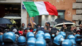 Italians pelt police with stones, set off fireworks as hundreds descend on PM's office to protest Covid curbs (VIDEOS)