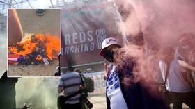 WATCH: Furious Manchester United fans burn US flag outside Old Trafford in protest against Glazers