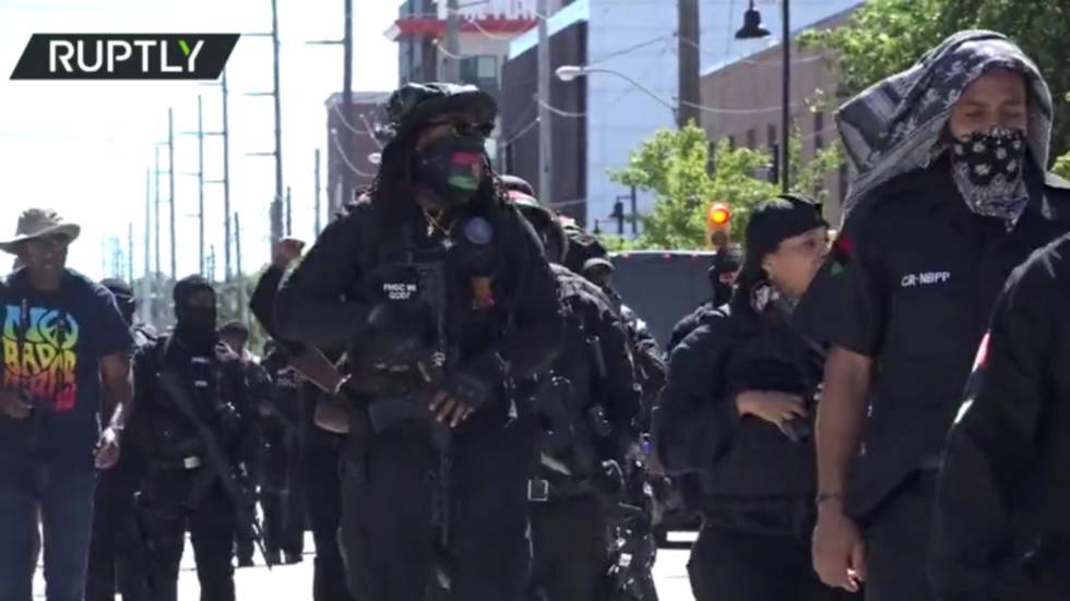 Armed protesters march for reparations in Tulsa, Oklahoma as the city marks 100th anniversary of black massacre