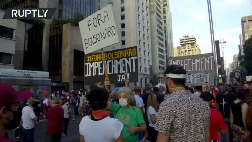 WATCH: Tens of thousands march against President Bolsonaro’s response to Covid in Brazil