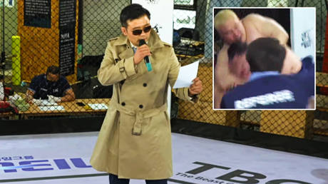 &lsquo;Intense&rsquo;: Bizarre ring announcer in trench coat barks at fighters on blood-splattered canvas at MMA scrap in South Korea (VIDEO)