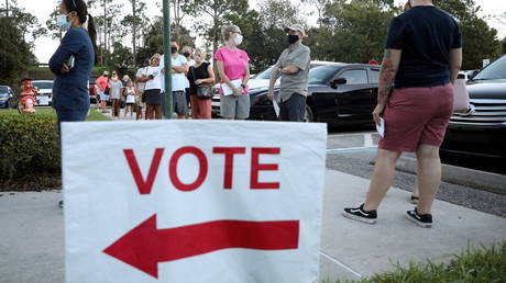 Voters line up to cast ballots during early voting session in Celebration, Florida