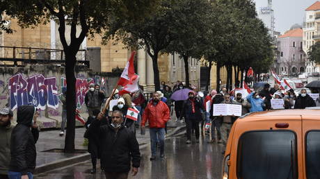 Protesters gathering at Martyrs' Square march towards Riad Al Solh Square during a protest demanding establishing a transitional government Beirut, Lebanon on April 10, 2021.