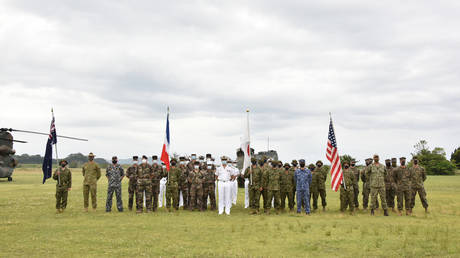 Representatives from Japan, the US, France, and Australia attending a joint military drill starting ceremony at JGSDF's Camp Ainoura in Sasebo, Nagasaki prefecture, on May 11, 2021. © AFP / Japan Ground Self-Defense Force