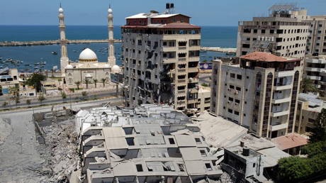 A picture taken with a drone shows the remains of a tower building which was destroyed in Israeli air strikes, amid a flare-up of Israeli-Palestinian violence, in Gaza City May 12, 2021© REUTERS/Mohammed Salem