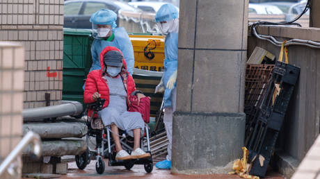 Hospital staffers seen wearing protective equipment outside of Taoyuan General Hospital in Taiwan's Taoyuan where 13,000 people will be quarantined amid hospital cluster, in Taoyuan, Taiwan on January 26, 2021.