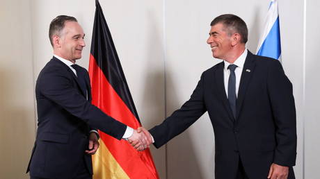 Israeli Foreign Minister Gabi Ashkenazi and his German counterpart Heiko Maas meet at the Ben Gurion International Airport near Tel Aviv, Israel, on May 20, 2021.