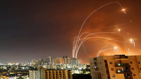 Israel's Iron Dome anti-missile system intercept rockets launched from the Gaza Strip over Ashkelon, May 12, 2021.