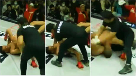 A referee has been forced to restrain an MMA fighter in wild style © Twitter / Barrelelapierna