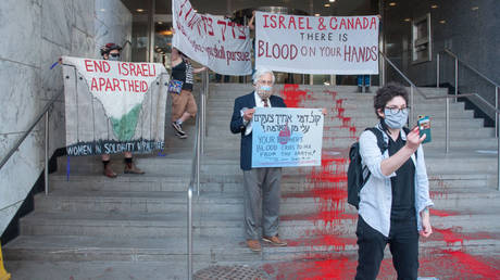 Jewish anti-war activists paint &lsquo;river of blood&rsquo; on steps of Israeli Consulate in Toronto to protest Gaza strikes