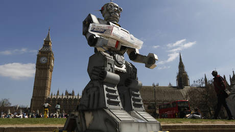 A robot is pictured in front of the Houses of Parliament and Westminster Abbey as part of the Campaign to Stop Killer Robots in London April 23, 2013.