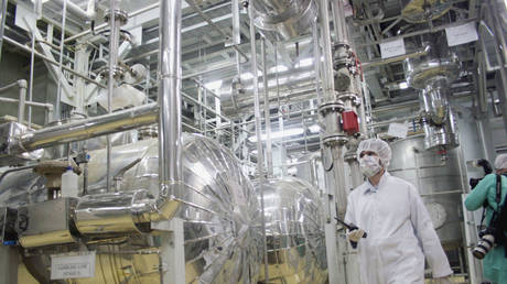 A worker walks inside of an uranium conversion facility March 30, 2005 just outside the city of Isfahan, about 254 miles (410 kilometers), south of capital Tehran, Iran.