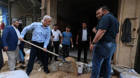 Yahya Sinwar, leader of the Palestinian Hamas movement's political wing, tours the Al-Rimal neighborhood in Gaza City, on May 26, 2021