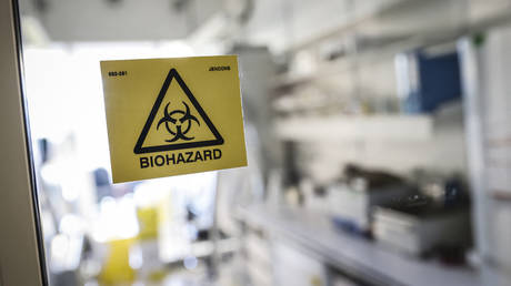 FILE PHOTO. Biohazard sticker on the entrance of a laboratory. © AFP / THOMAS SAMSON