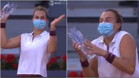 Terrified Aryna Sabalenka almost DROPS Madrid Open trophy after ticker tape explosion during ceremony (VIDEO)