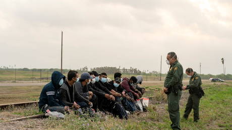 Central American migrants detained by the U.S. Border Patrol agents after crossing the Rio Grande river into the United States from Mexico in La Joya, Texas, US, April 27, 2021.