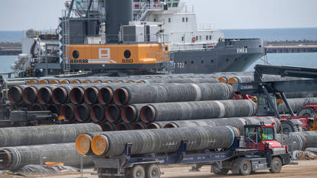 Pipes for the Nord Stream 2 Baltic Sea gas pipeline are loaded onto a ship at the Port of Mukran. © Stefan Sauer/picture alliance via Getty Images