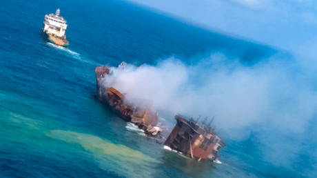 Smoke rises from a fire onboard the MV X-Press Pearl vessel as it sinks while being towed into deep sea in Sri Lanka on June 2, 2021.