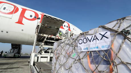 FILE PHOTO: Ethiopian Airlines staff unload AstraZeneca/Oxford vaccines under the COVAX scheme in Addis Ababa, Ethiopia, March 7, 2021