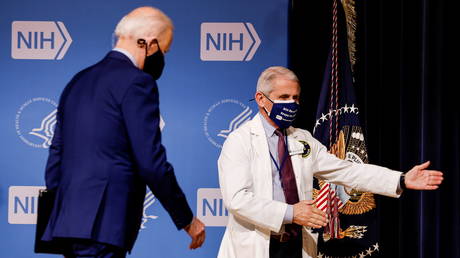 Dr. Anthony Fauci is shown directing Joe Biden during the president's visit to the National Institutes of Health in February.