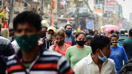 Women wearing face masks as a precaution against the spread of covid 19, as they shop in the crowded market at sadar bazar. © Manish Rajput/SOPA Images/LightRocket via Getty Images