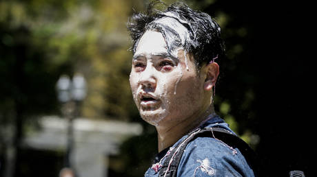 Andy Ngo, a Portland-based journalist, is seen covered in unknown substance after unidentified Rose City Antifa members attacked him on June 29, 2019 in Portland, Oregon