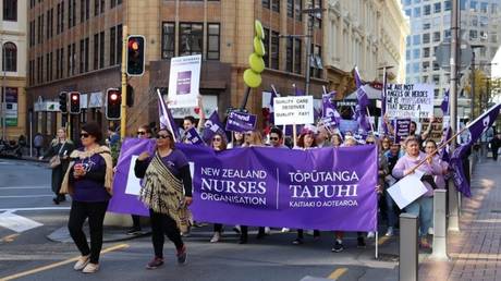 &lsquo;Under-resourced & under-supported&rsquo;: Tens of thousands of New Zealand nurses go on strike for better pay, safer work (VIDEOS)