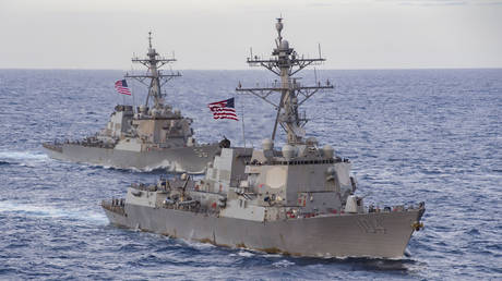 FILE PHOTO. The US guided-missile destroyers USS Sterett and USS John S. McCain are pictured in the South China Sea.