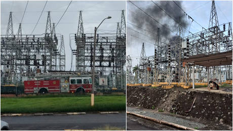 A power plant in San Juan, Puerto Rico is seen as firefighters work to extinguish a large blaze, June 10, 2021.