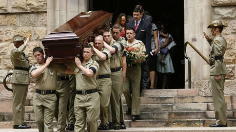 FILE PHOTO. Australian Army personnel carry the coffin of Trooper David Pearce from the Cathedral of Saint Stephen in Brisbane, 17 October 2007. © AFP / Eddie SAFARIK.