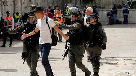 Israeli police detain a Palestinian man during a riot in Jerusalem’s Old City, May 2021. © Ammar Awad/Reuters