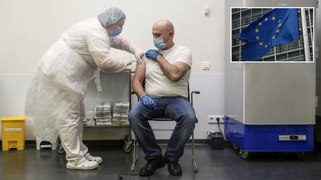 A man receives an injection with Sputnik V vaccine against the coronavirus disease (COVID-19) at a vaccination centre opened at the Yandex Go centre for drivers and couriers in Moscow, Russia January 27, 2021. © REUTERS/Maxim Shemetov; (inset) © Carl Court/Getty Images