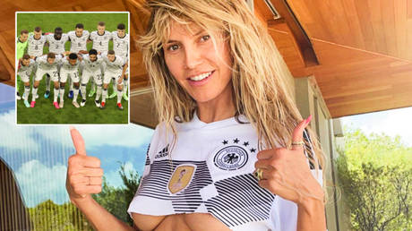 ‘Good luck today, Germany’: Supermodel Heidi Klum leaves very little to the imagination as she cheers nation in tiny football top